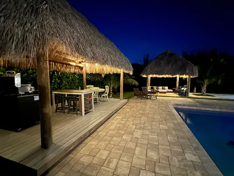 Nightime view of griddle and entertaining area