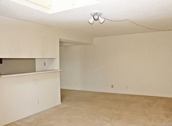 Living Room with open bar to kitchen.