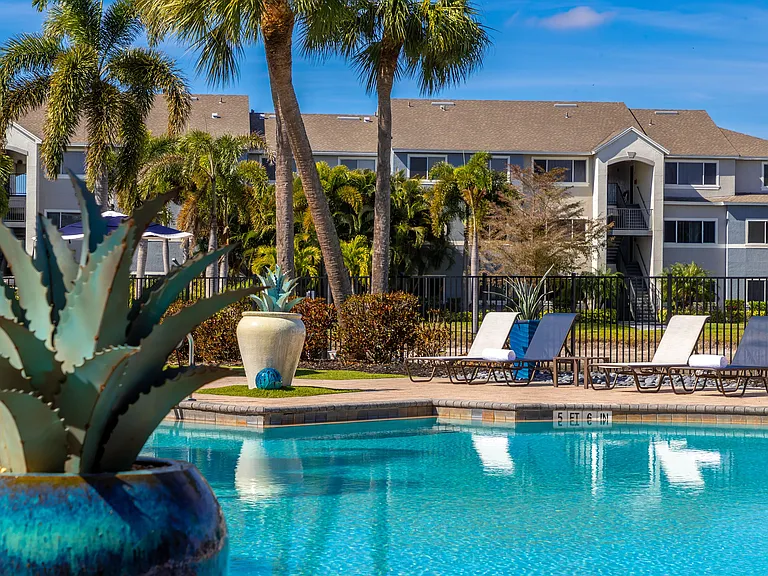 Relax poolside in a peaceful retreat designed for comfort, complete with plush loungers and scenic views.