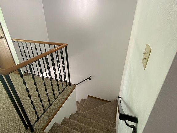 Staircase from exterior private entrance to upper level apartment