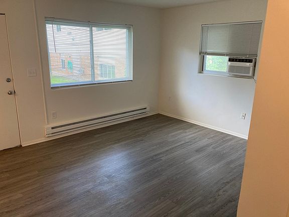 Living room with brand new window air conditioner.