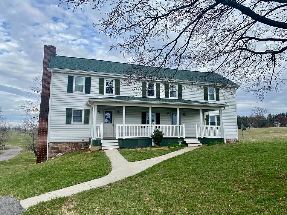 Beautiful update farmhouse with deep porch for sitting.