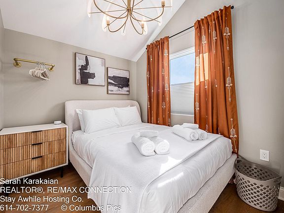 The smaller of the two bedrooms has a queen bed with a Helix mattress and blackout blinds.