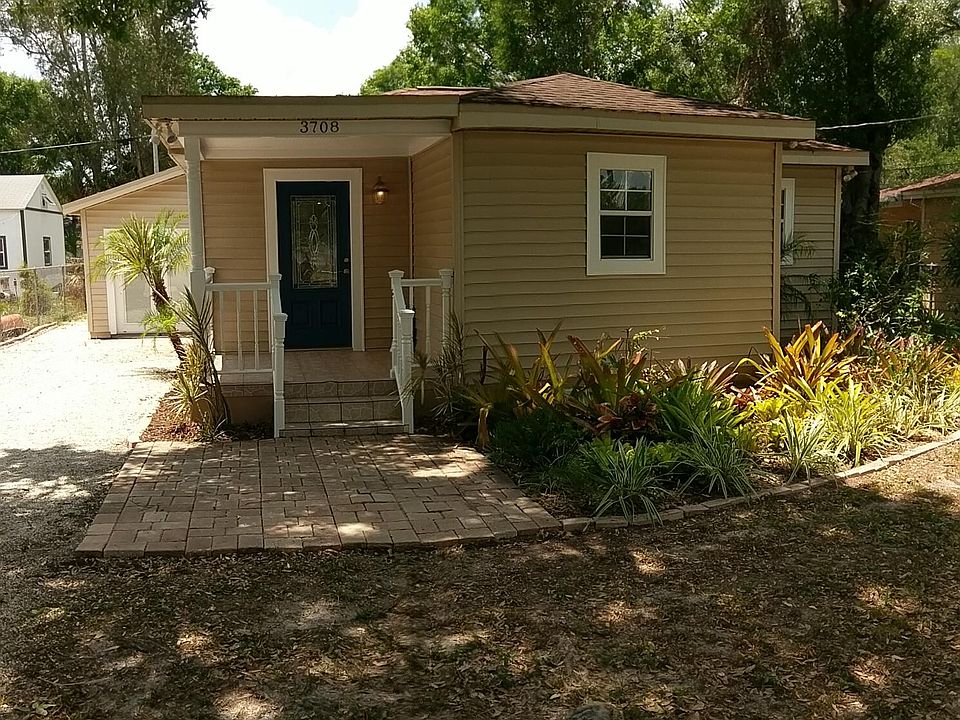 Detached building on the left,  w French doors. 