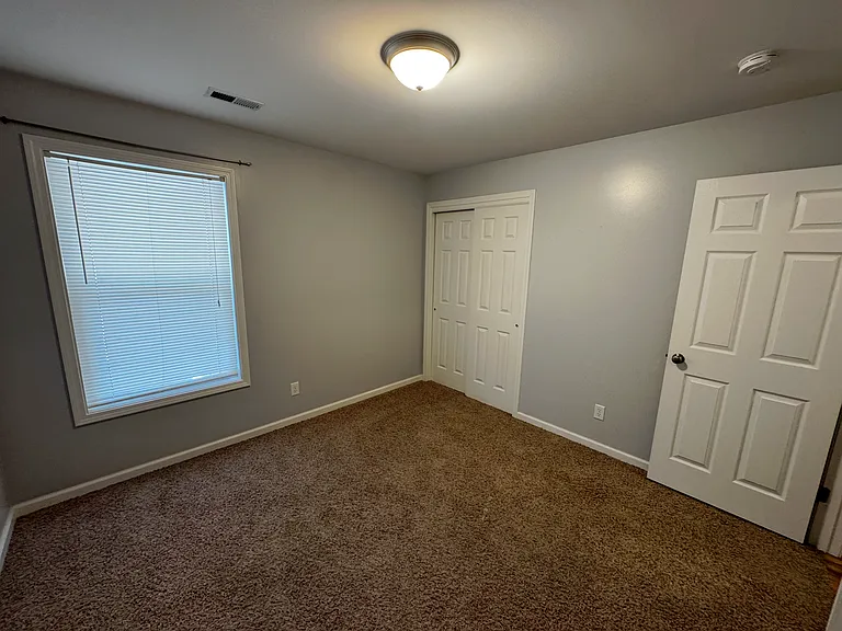 Third room that can be a bedroom or a home office for those who work from home. It's a cozy area with a window that looks out to the carport. Just look out the window and you can see who shows up without having to check the front door.