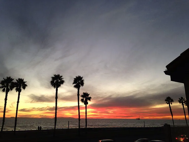 Gorgeous sunsets in front of this beach front FURNISHED vacation SMOKE/Pet FREE condo in Huntington Beach, Ca.