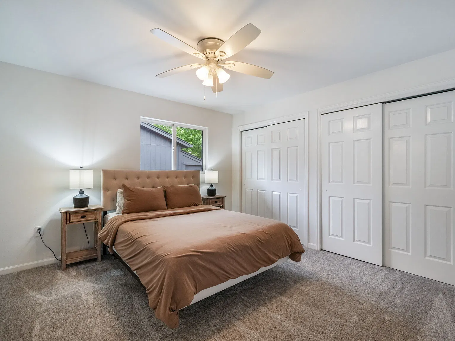 Master bedroom- attached bathroom with standing glass shower and two closets
