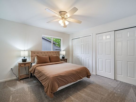 Master bedroom- attached bathroom with standing glass shower and two closets