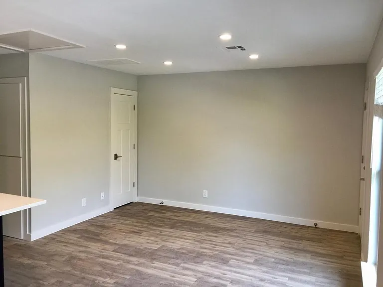 Living room w/ coat closet