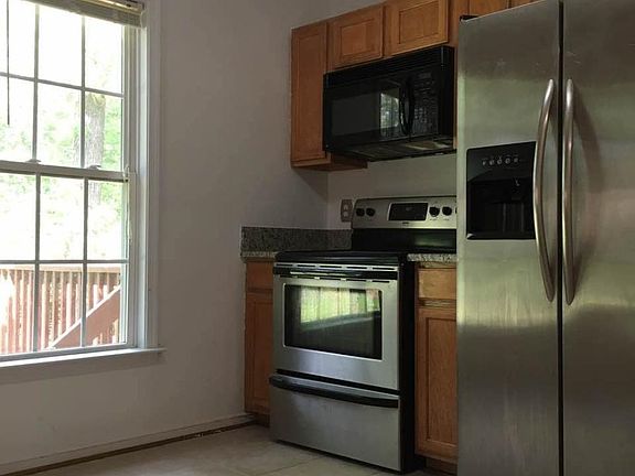 Kitchen with stainless steel appliances and granite couterto