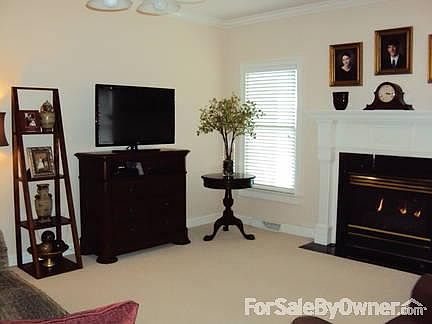 Downstairs Den
						:
						Downstairs den has gas logs.