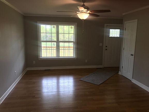 Living room with oak floor. Coat closet.