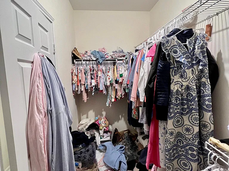 Large master closet with second half not shown.