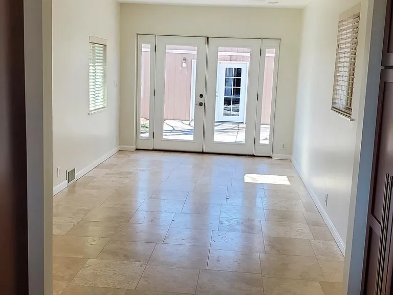 Flexible space with French doors to the outside can be used for dining, tv or office!