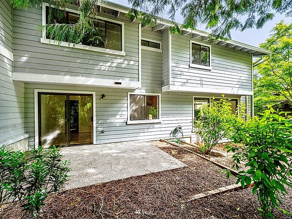 Back yard patio off the eat in kitchen offers lots of privacy.