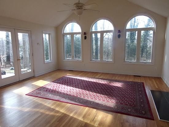 Sun room with walk-out to deck and patio, gas fireplace, vaulted-ceiling