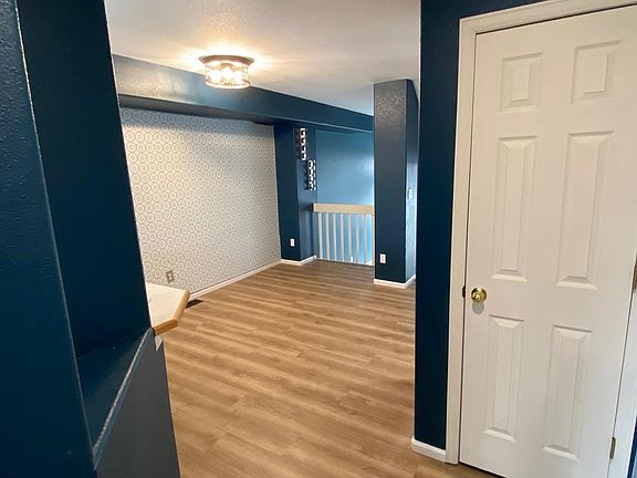 Entry Hallway into Dining Area off Kitchen- NEW FLOORS!