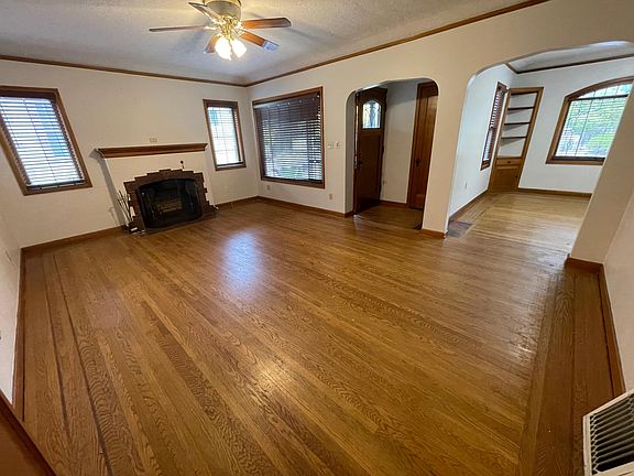 Living room and showing front entrance and dining room.