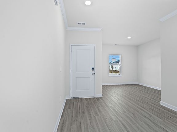 The foyer opens up to a flex space or home office