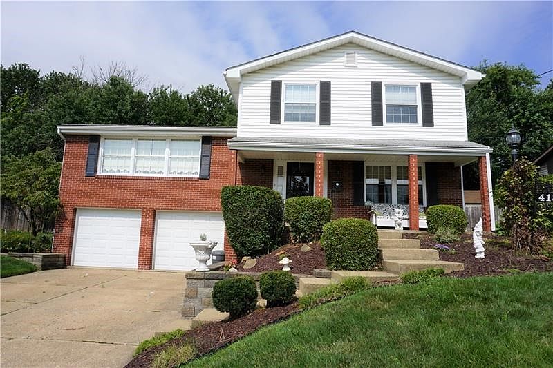 Stunning curb appeal.  Covered front porch and beautiful landscaping
