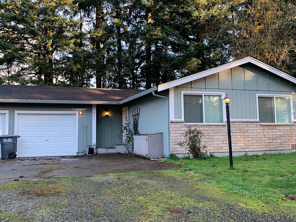 Clean and open front entry with attached one-car garage