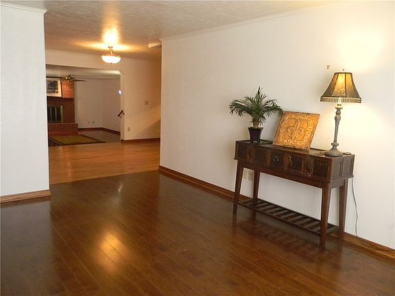 Living area open to dining room and den.