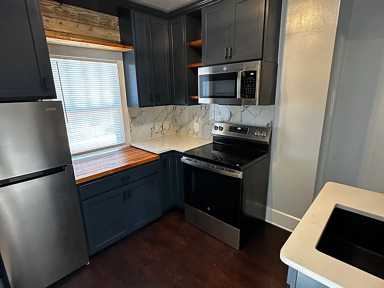 Brand new kitchen - custom cabinets w. lazy Susan, stainless steel appliances, quartz countertops-marble backsplash, handmade butcher block custom top, granite sink
