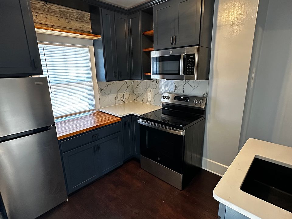 Brand new kitchen - custom cabinets w. lazy Susan, stainless steel appliances, quartz countertops-marble backsplash, handmade butcher block custom top, granite sink