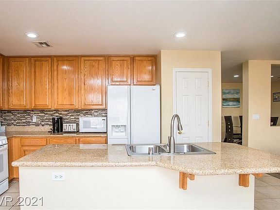 4th image of 9736 W Tompkins Ave