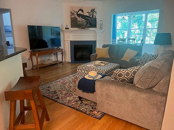 Family room with fireplace and large TV