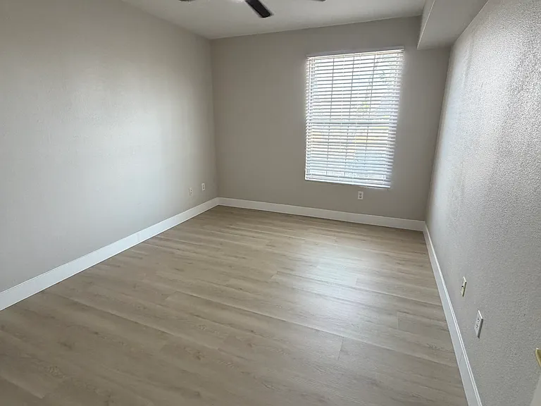 Second bedroom. new flooring, new ceiling fan and new blinds, freshly painted