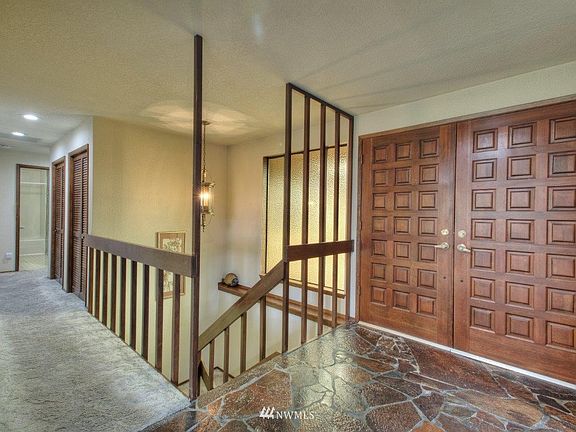Double doors & stone floor entry.