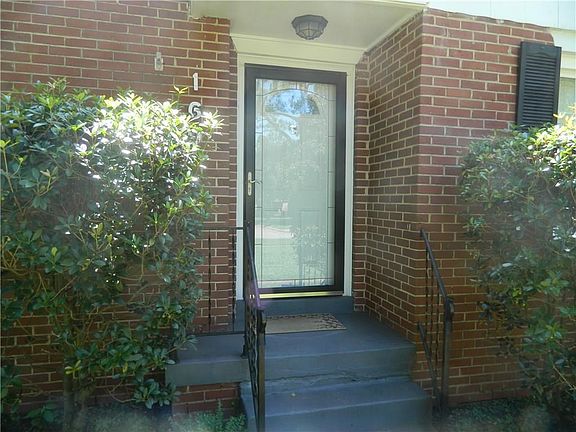 Nice Pella front storm door, and vinyl windows throughout.