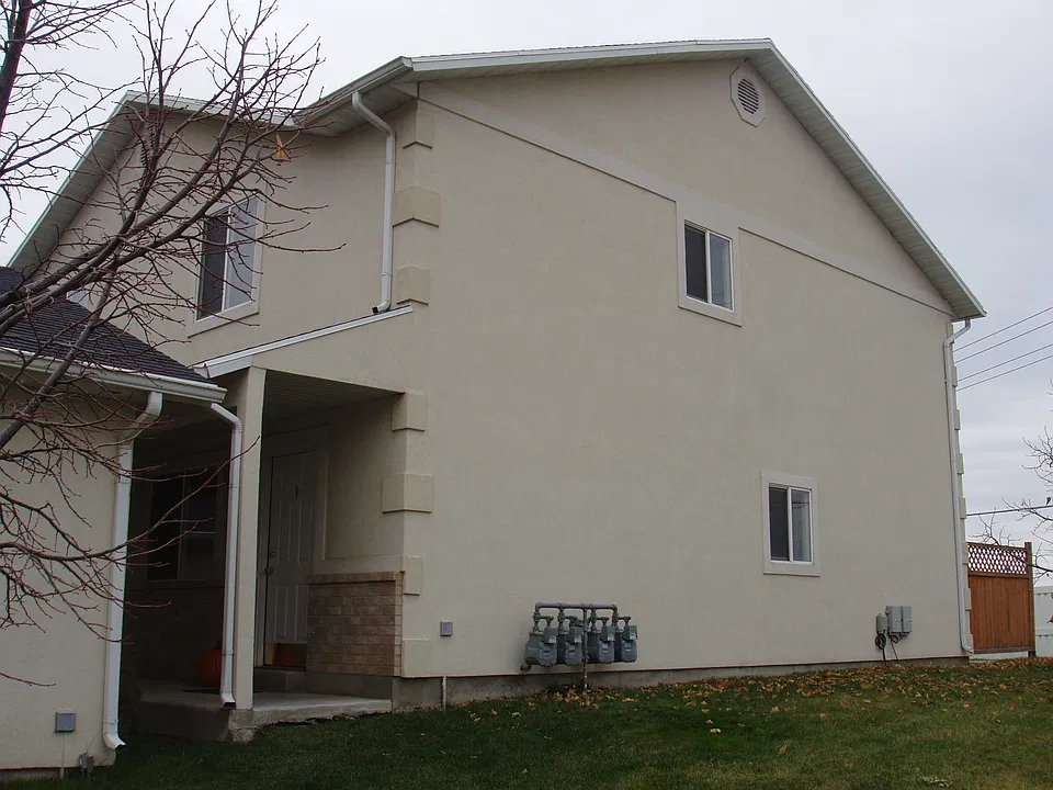 Side view with front door and yard