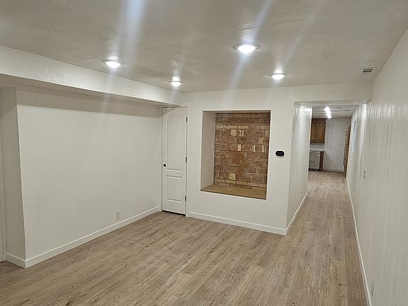 Living room looking down hallway towards kitchen