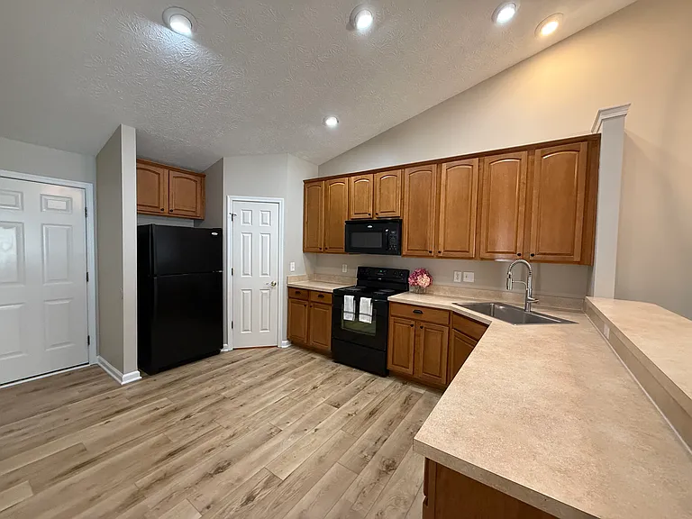 Kitchen with dishwasher, microwave, stove and refrigerator included in the rental.