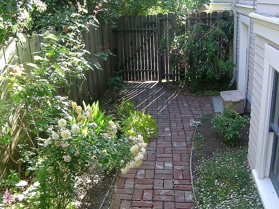 The brick path and garden outside the door.
