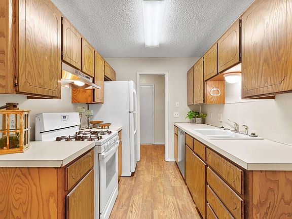 KITCHEN HAS FRESH APPLIANCES AND FAUX HARDWOOD FLOORING!