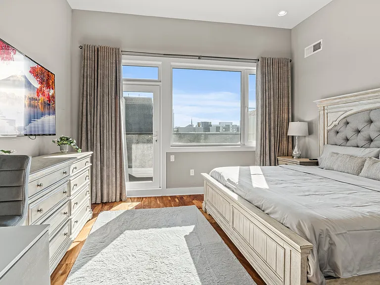 Primary bedroom with private balcony