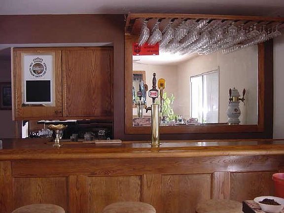 This custom bar built into the family room is perfect for entertaining!