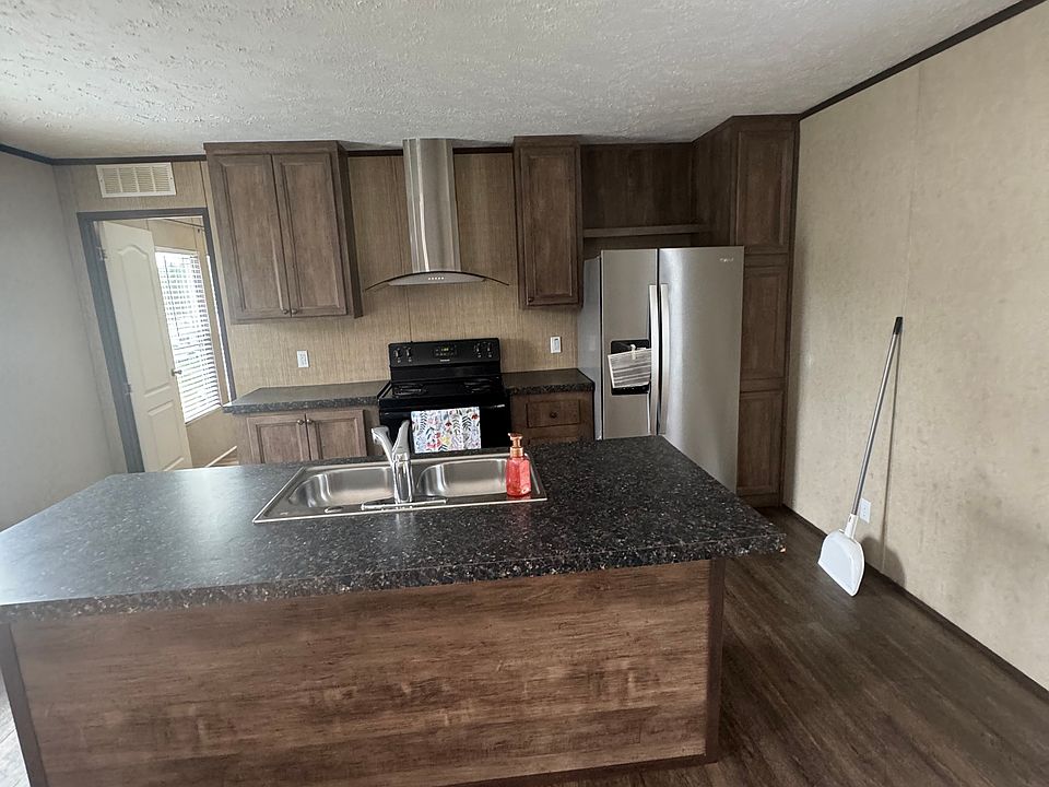 Kitchen and eat in bar area.