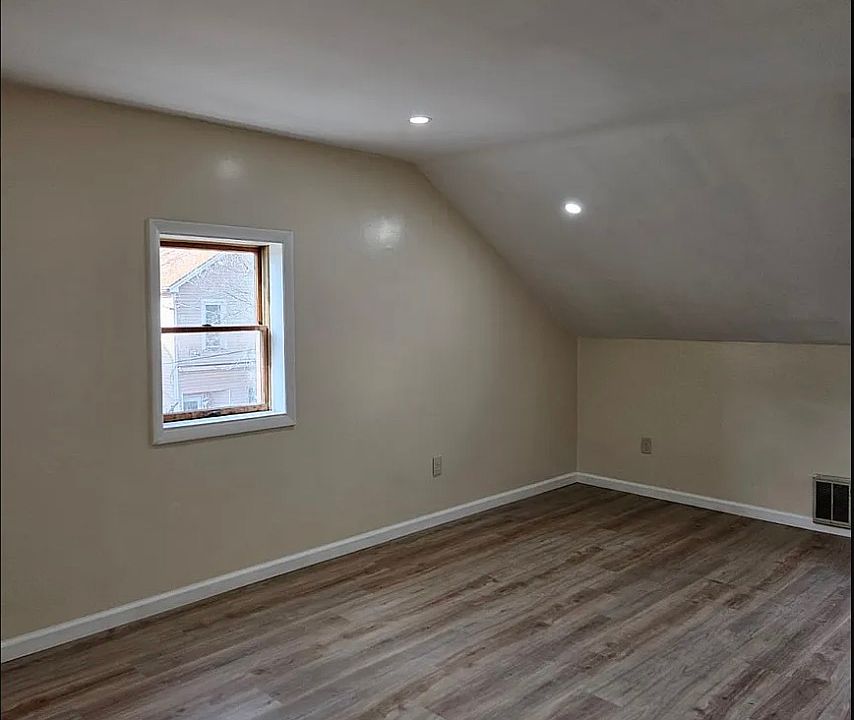 Large bedroom in a two bedroom apartment.