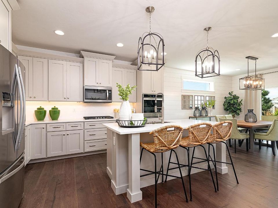 Representative Photo - Well-equipped kitchen and elegant dining area