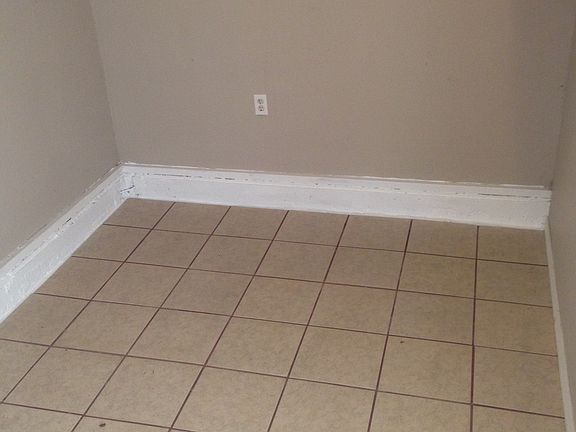 seperate utility room with door off of kitchen