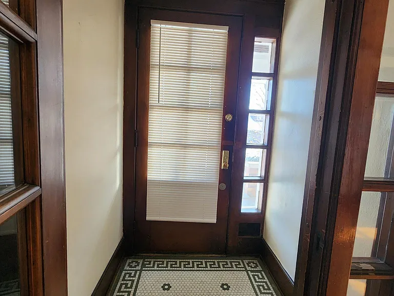 Front Door / Front Hall
Mail door is on the lower right of the door.