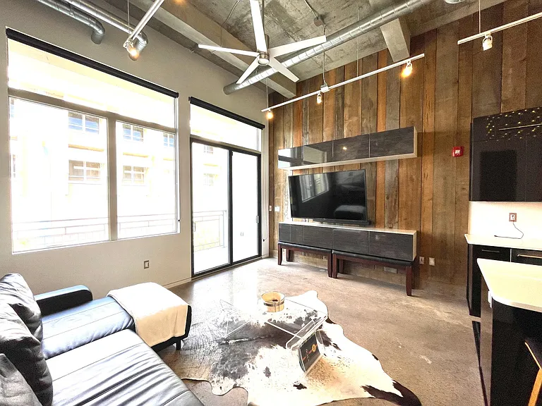 Wood paneling throughout, ceiling fan, plenty of storage