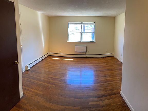 Living room with beautiful hardwood floors and plenty of natural light.