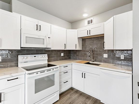 Microwave, garbage disposal, electric range, refrigerator, dishwasher. All new.