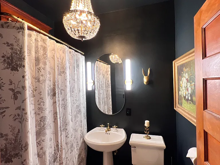 Lush bathroom with custom chandelier, all dimable lights for a nice relaxing soak in the ball and claw foot tub.