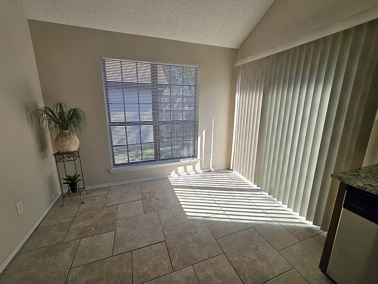 Eating / Dining Area Off of Kitchen With Patio Doors to the Patio and and Back Yard